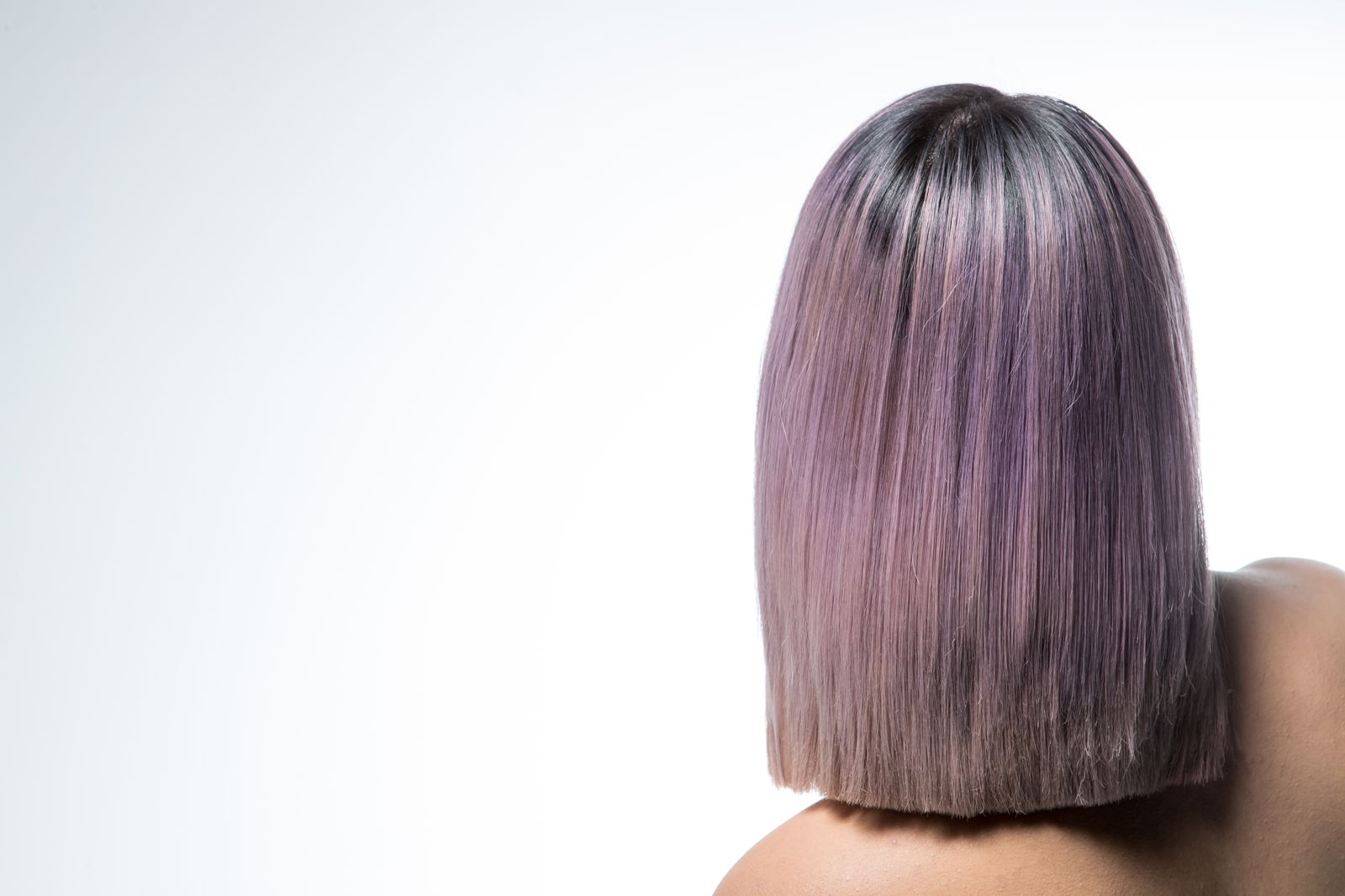 Back of a model with pastel-lilac bob