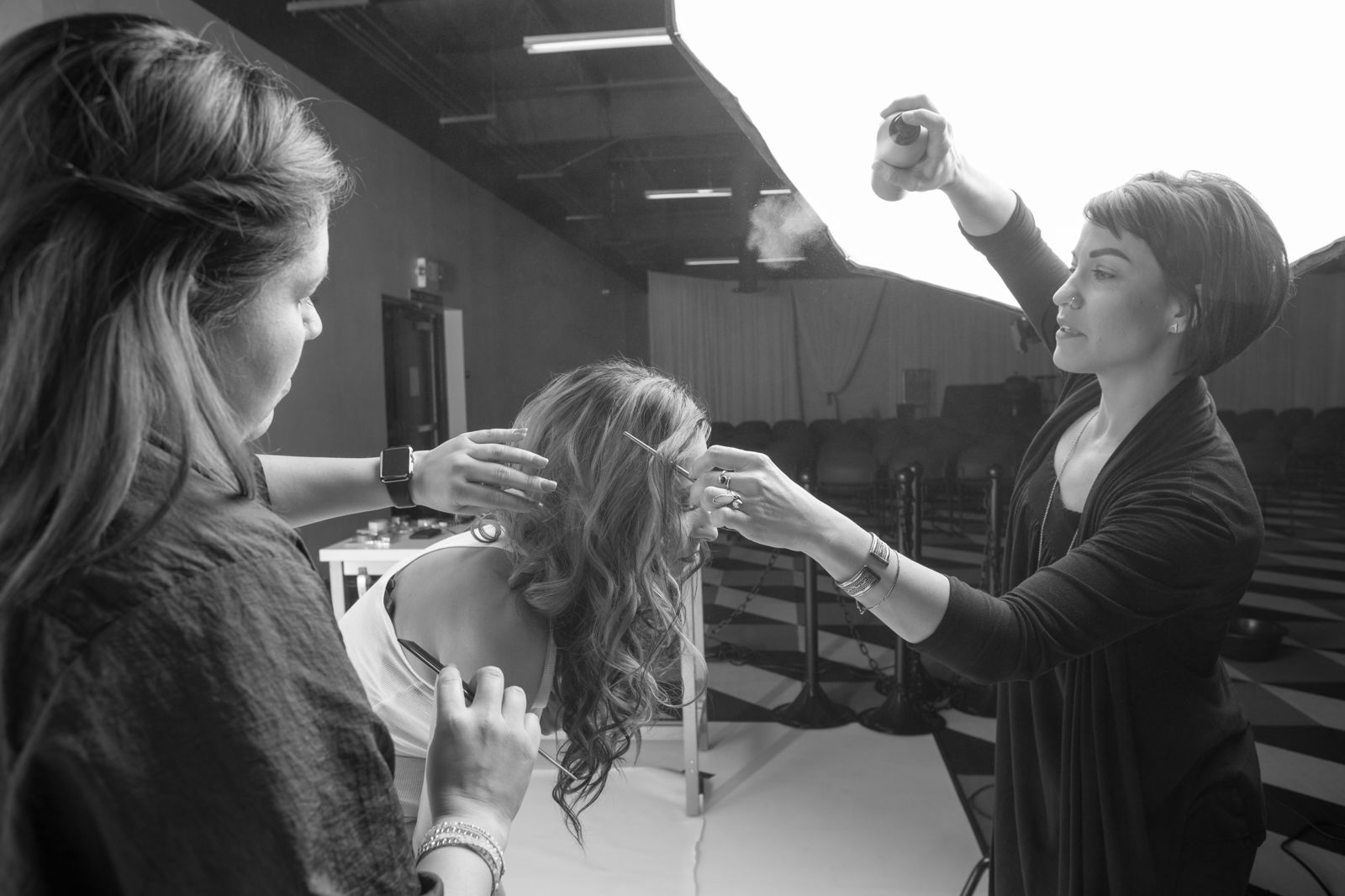Prepping for the photo shoot, using lots of hairspray!