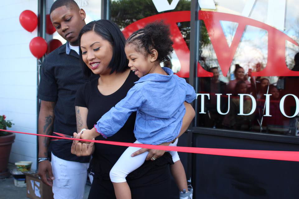avier and Michelle White, the owners of XM Hair Studio at a ribbon cutting for their new studio