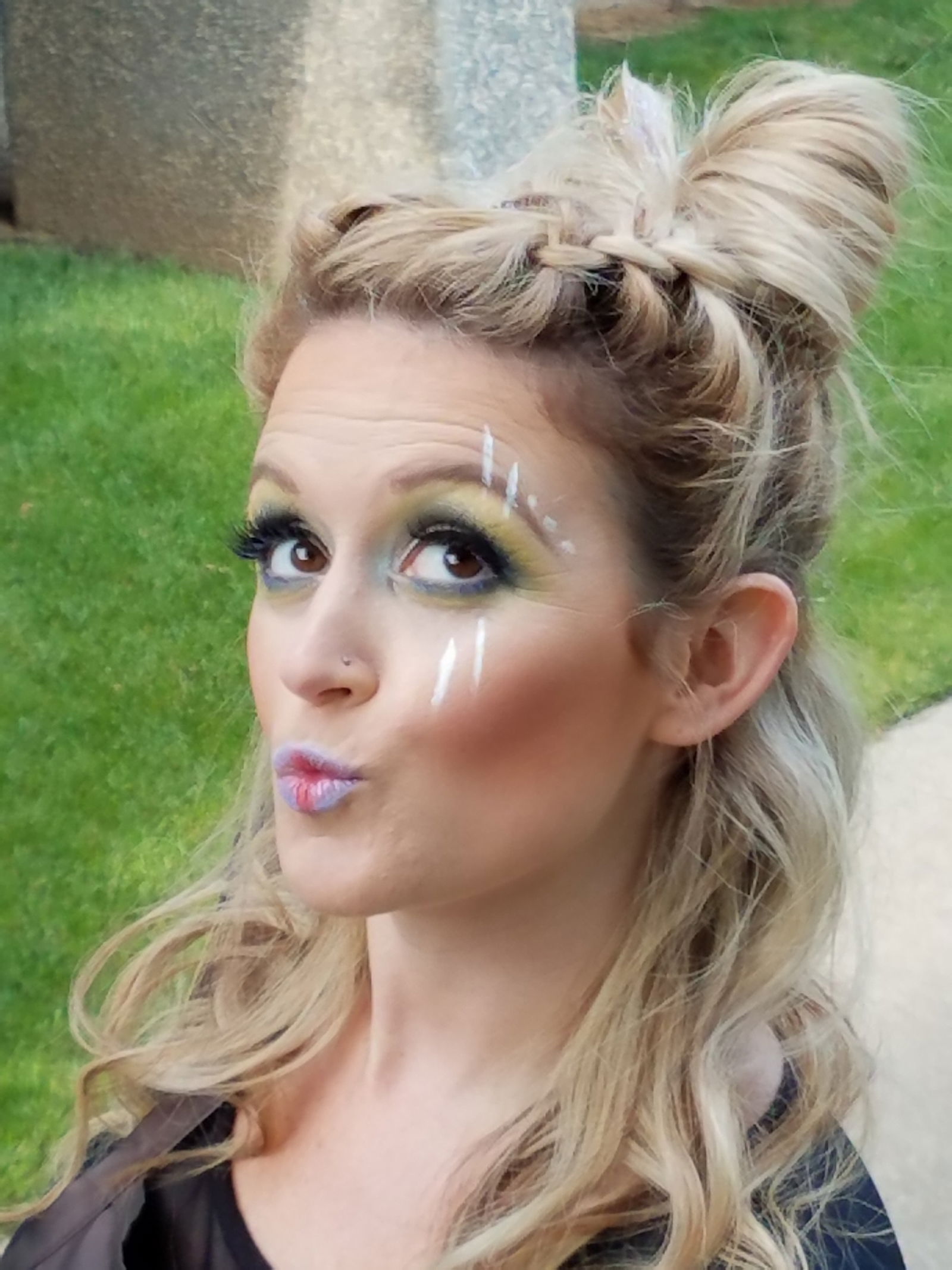 Cute festival up-do and fun makeup - complete with duck face!