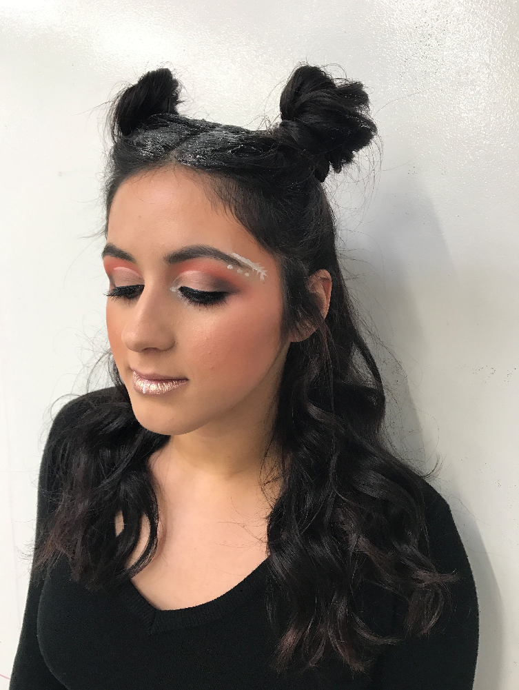 Showing off glittery festival makeup and hair.